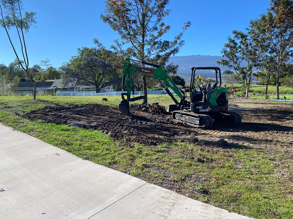 Excavator being used to provide excavation services near Kona.