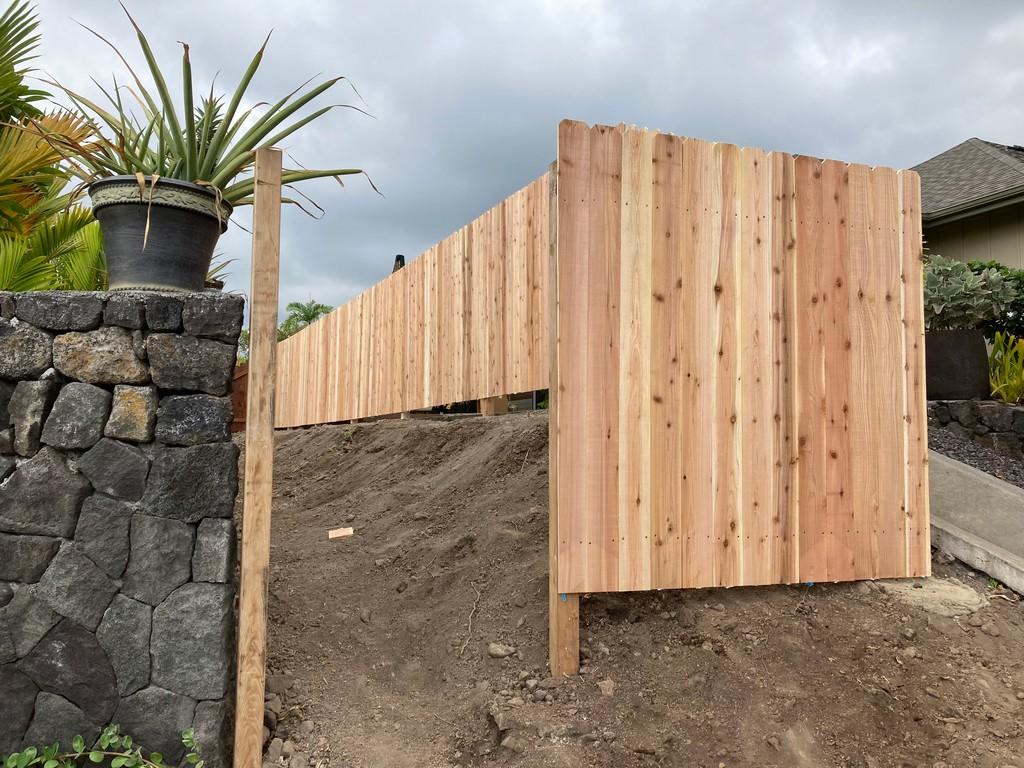 When Hawaii residents ask themselves how do I build a fence, Aina Landscaping has the answers. This photos shows an example of a fence being built.