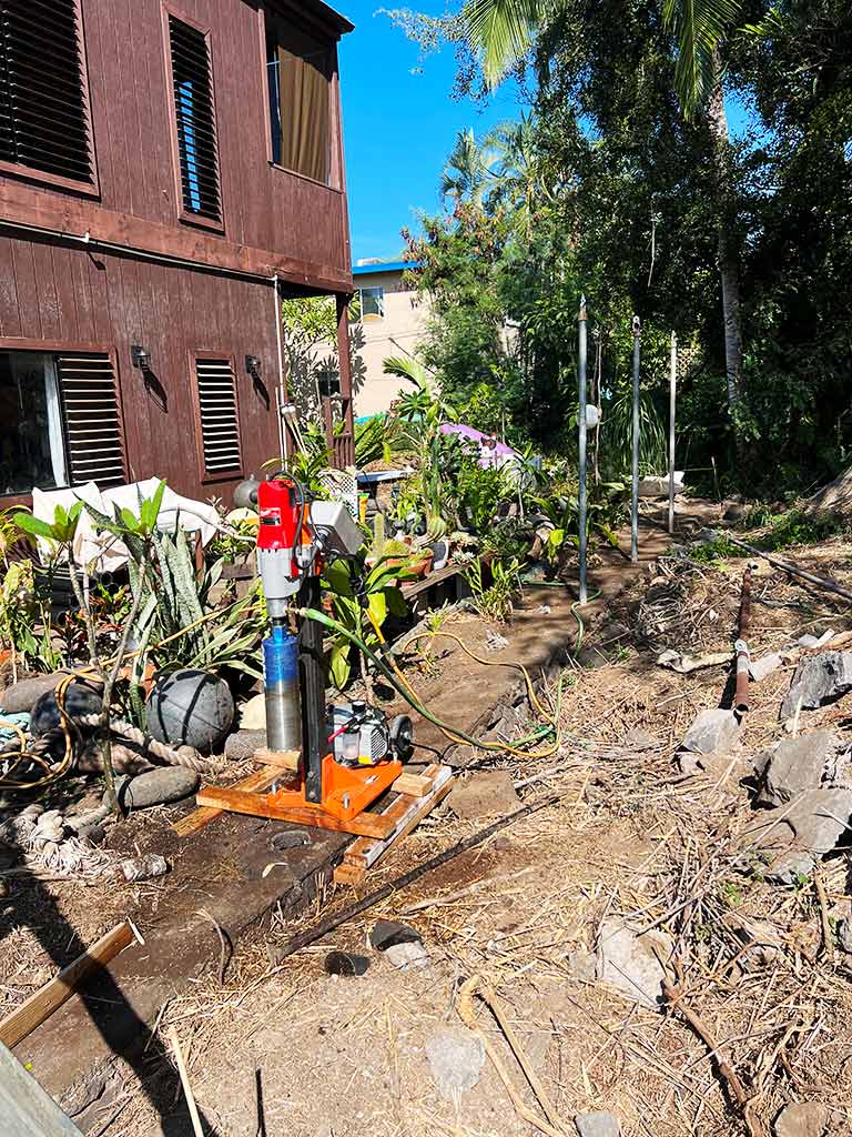 The drill was used to create post holes for a new backyard fence.