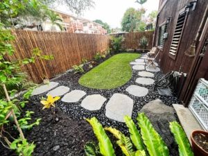 Hawaii backyard after completion of turf, edging, and lava rock installation, Kailua-Kona.