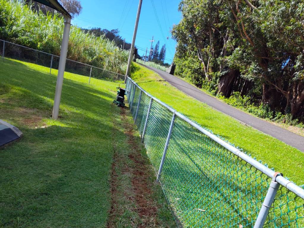 Landscaping professional removing old turf.