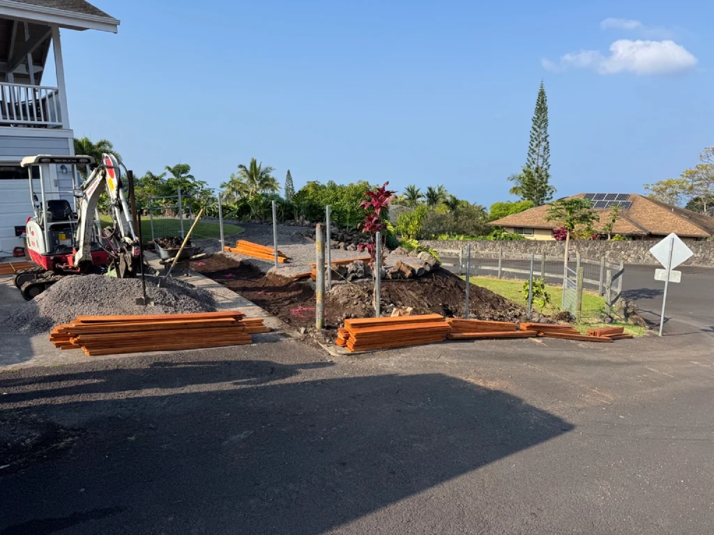 Materials for Kailua-Kona landscape project include weed barrier and lava rock, native Hawaiian plants, and pre-stained wood fence.