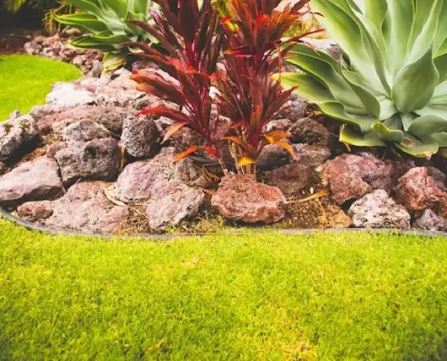 Firewise landscaping in Kailua-Kona with a gravel and stone border creates a non-combustible barrier to help reduce the fire risk from burning debris.