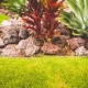 Firewise landscaping in Kailua-Kona with a gravel and stone border creates a non-combustible barrier to help reduce the fire risk from burning debris.